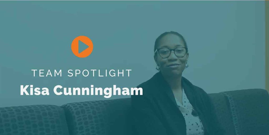 A photo of TOC staff member, Kisa Cunnningham sitting on a couch.