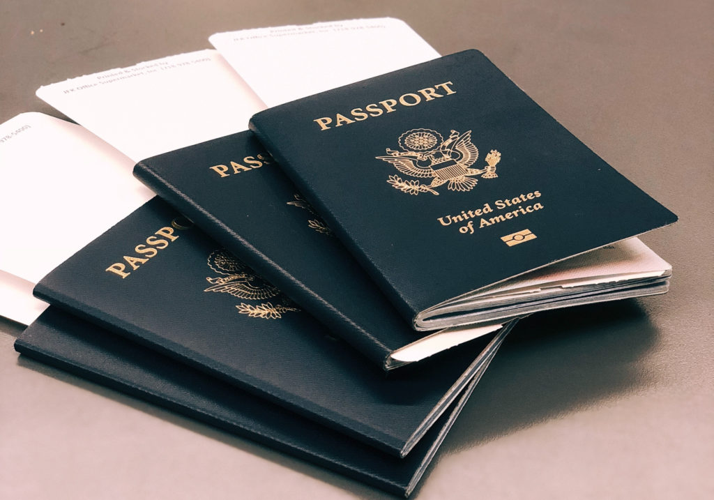 A stack of four passports.