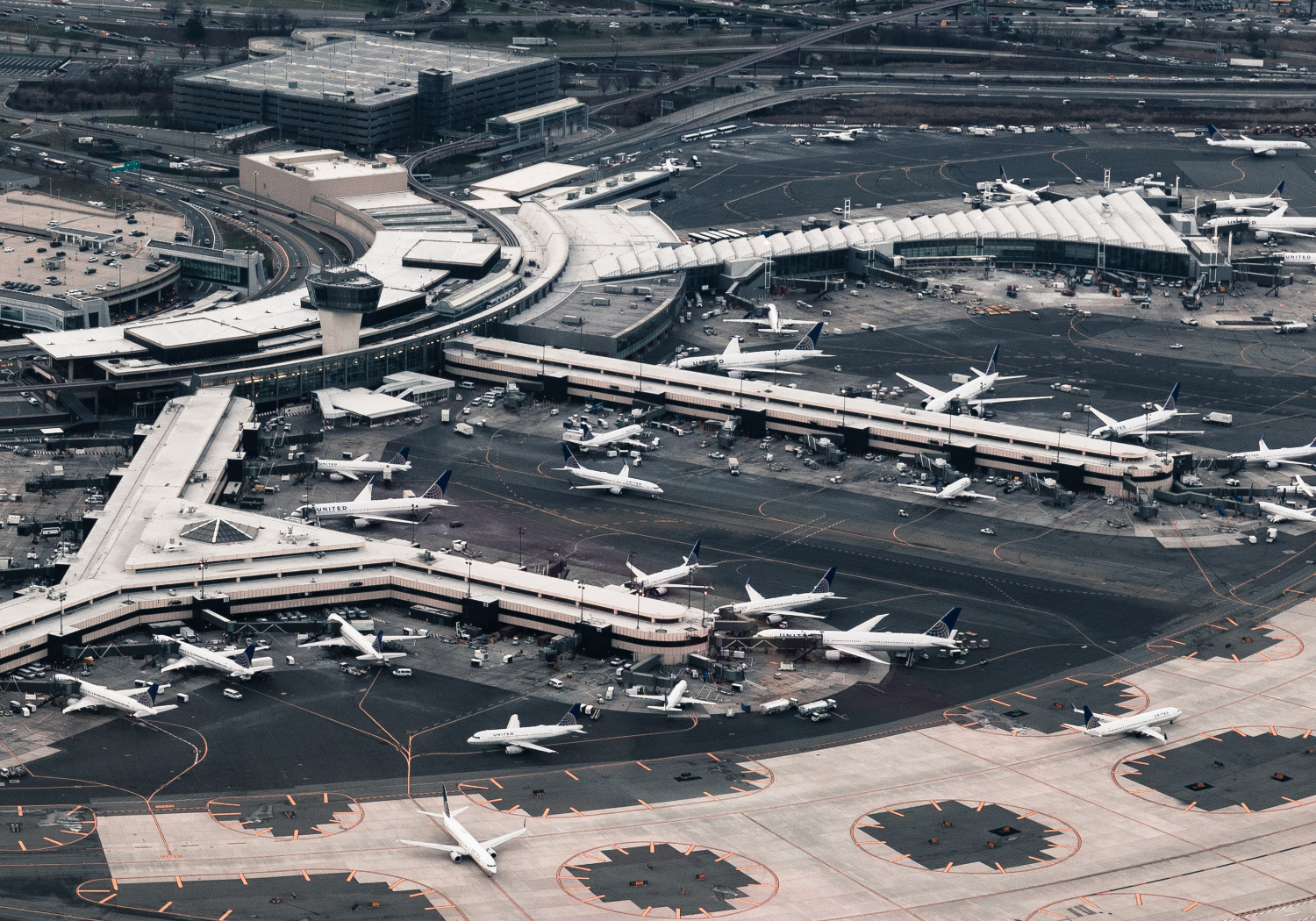 The overhead view of a busy terminal with many planes.